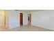 Bedroom with tile floors, access to bathroom and closet at 703 Portia N St, Nokomis, FL 34275