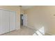 Bright bedroom with double door closet and tile floor at 703 Portia N St, Nokomis, FL 34275