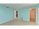 Light blue bedroom with tile floor and closet at 703 Portia N St, Nokomis, FL 34275