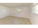 Bright bedroom with tile flooring and a view from the window at 703 Portia N St, Nokomis, FL 34275