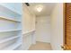 White closet with shelves and hanging rod at 703 Portia N St, Nokomis, FL 34275