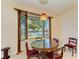 Bright dining area with water views at 703 Portia N St, Nokomis, FL 34275