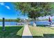 Private dock with walkway offering waterfront access at 703 Portia N St, Nokomis, FL 34275