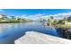 Wooden dock extending over the calm water at 703 Portia N St, Nokomis, FL 34275