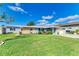 Well-maintained home with attractive landscaping and a large yard at 703 Portia N St, Nokomis, FL 34275