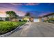 Inviting single-story home with landscaped yard and attached garage at 703 Portia N St, Nokomis, FL 34275