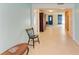 Long hallway with light walls and tile floors, offering views into other rooms at 703 Portia N St, Nokomis, FL 34275