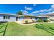House exterior with landscaped yard at 703 Portia N St, Nokomis, FL 34275