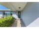 Inviting house exterior featuring a walkway and lush landscaping at 703 Portia N St, Nokomis, FL 34275