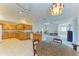 Open kitchen with granite countertops and oak cabinets at 703 Portia N St, Nokomis, FL 34275