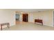Open living area with tile floors and built-in wooden cabinetry at 703 Portia N St, Nokomis, FL 34275