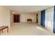 Spacious living room with tile floors and lots of natural light at 703 Portia N St, Nokomis, FL 34275