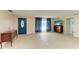 Bright living room with tile floors and a view of the bathroom at 703 Portia N St, Nokomis, FL 34275