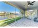 Screened porch with water views and ceiling fan at 703 Portia N St, Nokomis, FL 34275