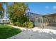 Inviting pool area with screened enclosure and lush landscaping at 18069 Ohara Dr, Port Charlotte, FL 33948