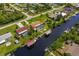 Aerial showcasing the property's canal-front location and neighborhood at 18069 Ohara Dr, Port Charlotte, FL 33948