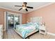 Relaxing bedroom with a queen bed and access to a balcony at 18069 Ohara Dr, Port Charlotte, FL 33948