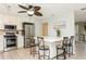 White kitchen with stainless steel appliances and breakfast bar at 18069 Ohara Dr, Port Charlotte, FL 33948