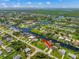 Bird's-eye view showcasing a waterfront property with canal access at 18069 Ohara Dr, Port Charlotte, FL 33948