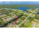Aerial view of canal-front home with private dock and lush landscaping at 18069 Ohara Dr, Port Charlotte, FL 33948