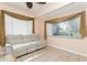 Relaxing sunroom with large windows and reclining sofa at 18069 Ohara Dr, Port Charlotte, FL 33948