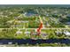 High-angle view of the house, canal, and neighborhood at 18069 Ohara Dr, Port Charlotte, FL 33948