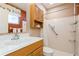 Clean bathroom with shower, toilet, sink, and wood vanity at 18069 Ohara Dr, Port Charlotte, FL 33948