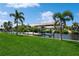 Private boat dock with lush green lawn and canal views at 18069 Ohara Dr, Port Charlotte, FL 33948