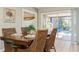 Casual dining area with wooden table and wicker chairs, pool view at 18069 Ohara Dr, Port Charlotte, FL 33948