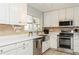 Clean and bright kitchen with stainless steel appliances at 18069 Ohara Dr, Port Charlotte, FL 33948