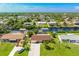 Wide shot of the house and surrounding neighborhood from above at 18069 Ohara Dr, Port Charlotte, FL 33948