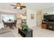 Open concept dining room with view of kitchen and access to patio at 18069 Ohara Dr, Port Charlotte, FL 33948