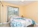 Cozy bedroom with a queen-size bed and tiled floors at 18069 Ohara Dr, Port Charlotte, FL 33948