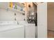 Convenient laundry room with washer, dryer, and shelving at 18069 Ohara Dr, Port Charlotte, FL 33948