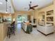Open living space with a view of the pool and kitchen at 5221 Laurel Oak Ct, North Port, FL 34287