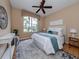 Bright bedroom with large window, and neutral decor at 5221 Laurel Oak Ct, North Port, FL 34287