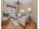 Cozy sitting room with comfortable seating and a large window at 5221 Laurel Oak Ct, North Port, FL 34287