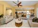 Spacious living room featuring comfortable seating and a view into the kitchen at 5221 Laurel Oak Ct, North Port, FL 34287
