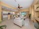 Open concept living room with kitchen and pool views at 5221 Laurel Oak Ct, North Port, FL 34287