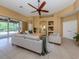 Living room with pool access, comfortable seating and ceiling fan at 5221 Laurel Oak Ct, North Port, FL 34287