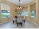 Casual breakfast nook with views of the pool and backyard at 5221 Laurel Oak Ct, North Port, FL 34287