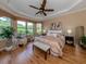 Bright main bedroom with a king-size bed and ample natural light at 5221 Laurel Oak Ct, North Port, FL 34287