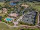Aerial view of community amenities including tennis courts and pool at 5221 Laurel Oak Ct, North Port, FL 34287
