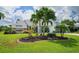 Landscaped front yard with tropical plants and curb appeal at 9 Bunker Ln, Rotonda West, FL 33947