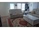 Comfortable living room with beige sofas and a marble-top coffee table at 733 S Green Cir, Venice, FL 34285