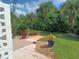 Landscaped backyard with tropical plants and patio at 733 S Green Cir, Venice, FL 34285