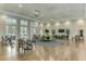 Spacious clubhouse interior with seating areas and hardwood floors at 12196 Alachua Ln, Venice, FL 34293