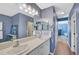 Spacious bathroom with double vanity and large mirror at 12196 Alachua Ln, Venice, FL 34293