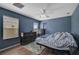 Spacious bedroom with wood flooring and dresser at 12196 Alachua Ln, Venice, FL 34293
