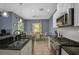 Bright kitchen with white cabinets, granite countertops, and stainless steel appliances at 12196 Alachua Ln, Venice, FL 34293